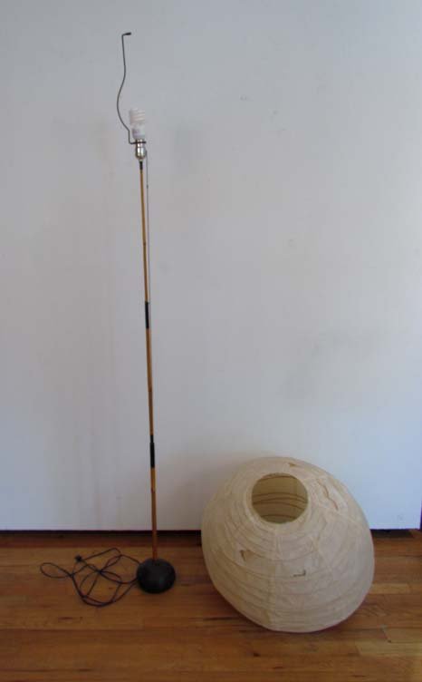 Isamu Noguchi Floor Lamp: Artist: Noguchi, Isamu Title: Floor Lamp with metal base resembling stone Medium: wood and metal Dimensions: 68 inches Provenance: Elvira Peake Collection