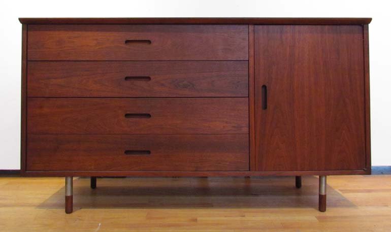 Mid Cen Walnut Credenza with aluminum feet: Title: Mid Cen Walnut Credenza with aluminum feet, 4 drawers and cabinet Date: mid 20th cen Medium: walnut, aluminum Dimensions: 31 x 54 x 18 inches Provenance: Elvira Peake Collection