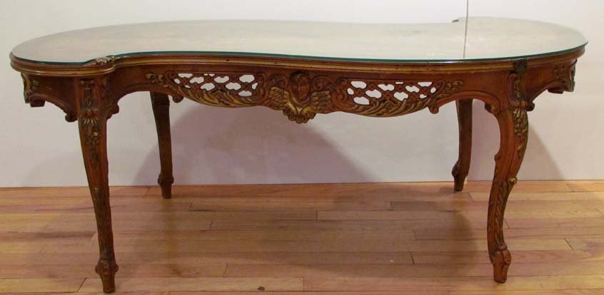 Tilde Shaped Veneered Floral Inlay Coffee Table: Title: Tilde Shaped Veneered Floral Inlay Coffee Table with glass top, reticulate edge Medium: veneered wood Dimensions: 18 x 46.5 x 20.5 inches