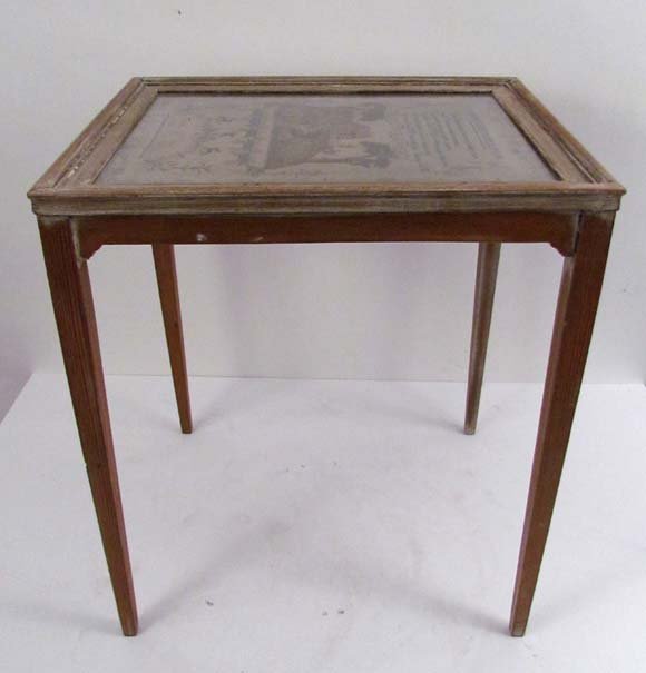religious reflection sampler fitted to a small: Title: occasional table w/ antique sampler top “a religious reflection” Date: sampler dates 1828 Dimensions: 21 x 18 x 15 inches Description: table with a sampler encased in tabletop with glass to