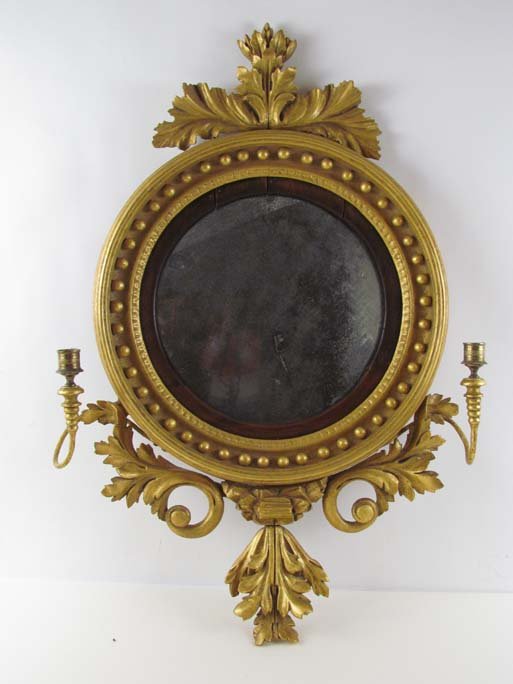 19th Century English Regency gilt beaded wall mirror w: Title: 19th century Regency English wall mirror with gilt beaded and molded frame and two single arm candelabra Medium: mirror, wood, brass Dimensions: diameter: 18.5 inches Provenance: Jane Roesch Co