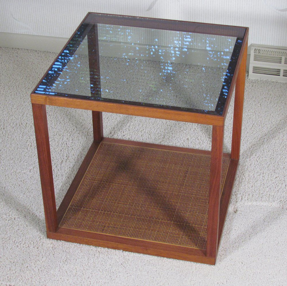 Paul McCobb walnut and glass side table: Artist: McCobb, Paul Title: Paul McCobb walnut and glass side table with caned covered inset base Dimension: 18 x 18 x 18 inches Provenance: Dr. Charles Hohing,