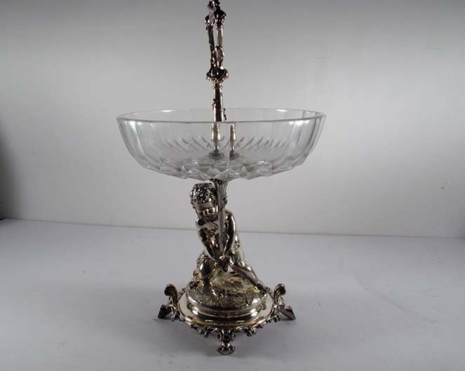 Antique CHRISTOFL crystal Centerpiece supported by a si: Artist: CHRISTOFL Title: Antique CHRISTOFL crystal Centerpiece FITTED CUT CRYSTAL BOWL supported by a elaborate silvered Putti Medium: silverplate and silver plate Dimensions: 16.5 x 10 x 10 inches Si