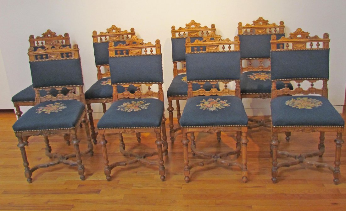 8 very good Jacobean style walnut chairs with elaborate: Artist: Baker Furniture made for 1886 Paris Exposition Title: 8 Jacobean style chairs with beautifully carved crest rails and galleries exhibiting ball turned supports. With fine antique velvet and ne