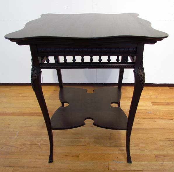 American Mahogany Parlor Table circa 1910: Title: American Mahogany Parlor Table circa 1910 with stick and ball gallery and cabriole legs with deep cut medial shelf. Ormolu mounts on knees Dimensions: 29.5 x 24 x 24 inches Provenance: An Oakla