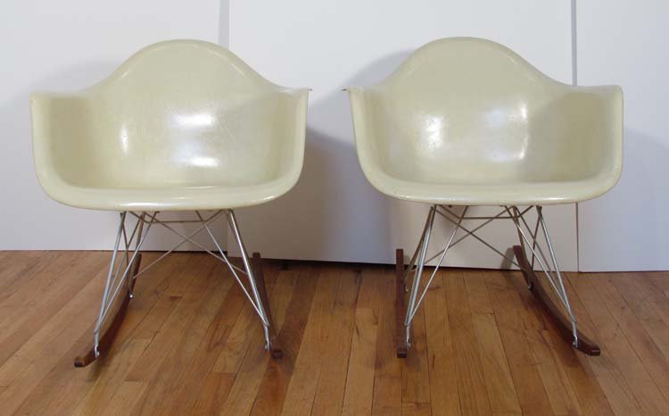 Pair of Eames Herman Miller Rocker Armshells: Artist: Eames, Charles and Rae for Herman Miller Title: Pair of Eames Rockers Medium: fiberglass, wood rocker base Dimensions: 26 x 25 x 26 inches Signature: Raised Herman Miller logo in fiberglass u