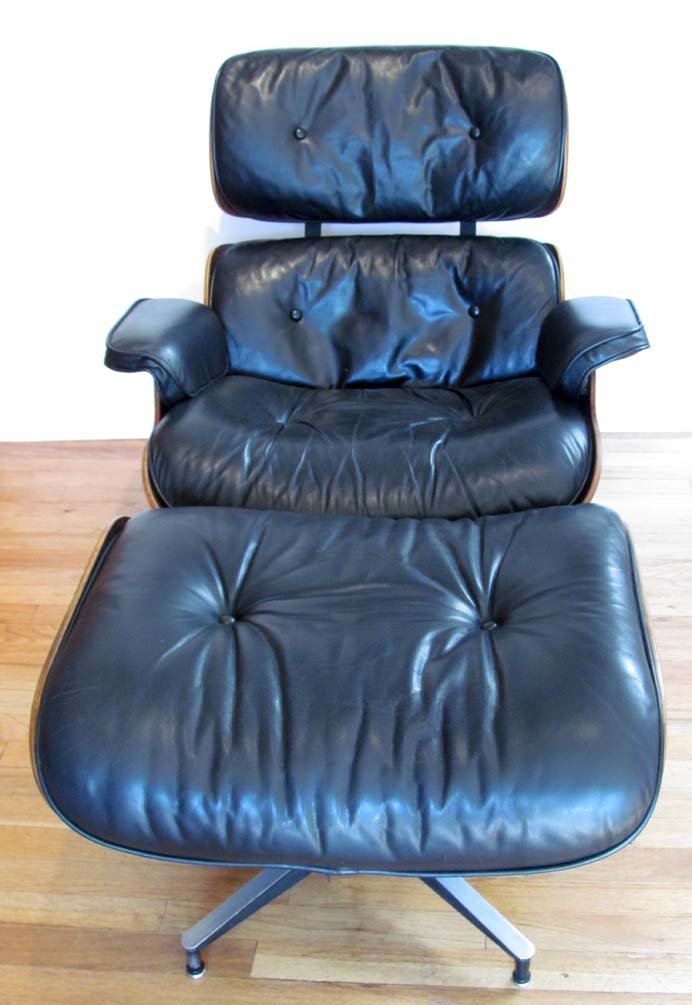 Eames 670 Rosewood Lounge Chair and Ottoman: Artist: Eames, Charles and Rae Title: 670 Rosewood Lounge Chair and Ottoman Medium: black leather upholstery, rosewood Dimensions: 31 x 34 x 32 inches (chair) Signature: Herman Miller metal label on