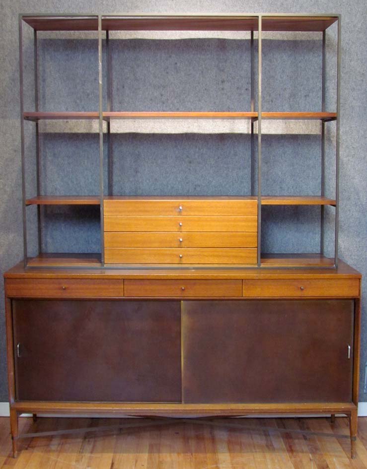 Paul McCobb Credenza with Shelf/Étagère Top: Artist: McCobb, Paul for Calvin Title: Paul McCobb Credenza with Shelf/Étagère Top. Top has brass rod frame with four drawers and shelves. Credenza sideboard base has two faux leather sliding doors.