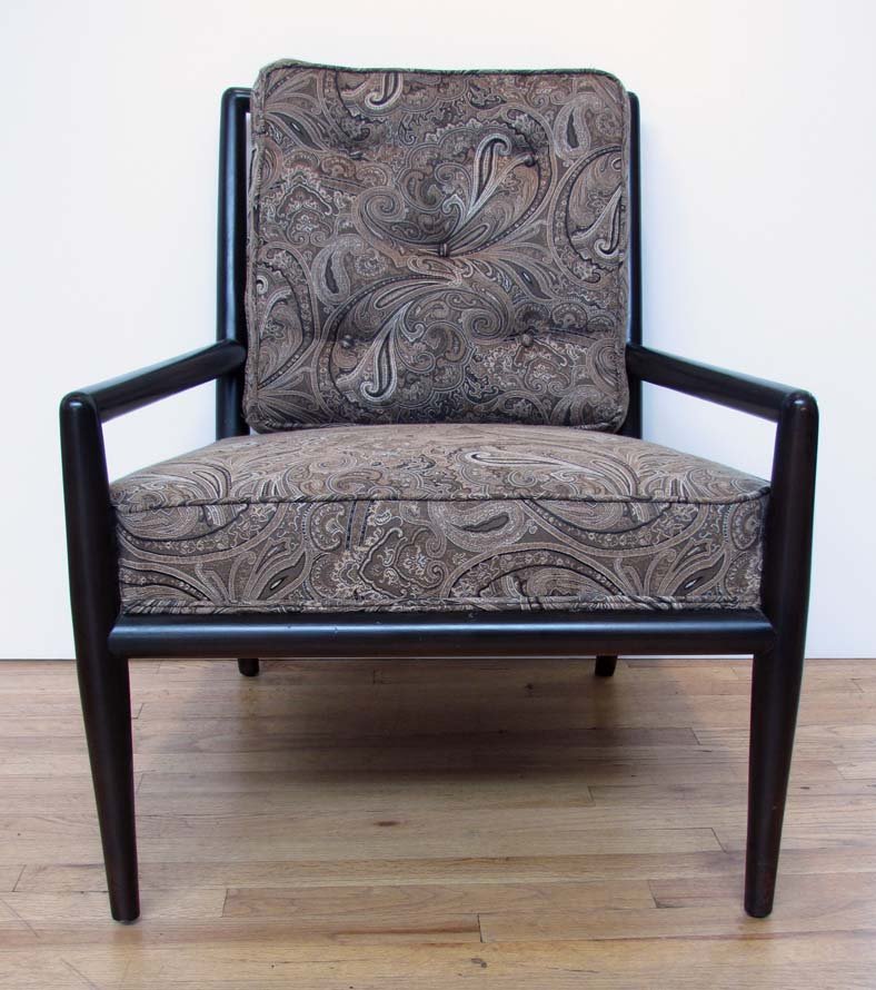 Black T.H. Robsjohn-Gibbings lounge: Artist: Robsjohn-Gibbings, T.H. Title: Black T.H. Robsjohn-Gibbings lounge Medium: ebonized wood and upholstery Dimensions: 30.5 x 25.75 x 29 inches