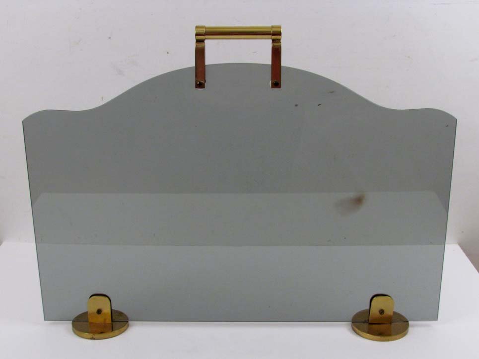 Karl Springer style Smoked Glass Fire screen w brass: Artist: Springer, Style of Karl Title: Karl Springer style Smoked Glass Fire screen w brass feet & Handle Medium: smoked glass, brass Dimensions: 20.5 x 27.25 inches