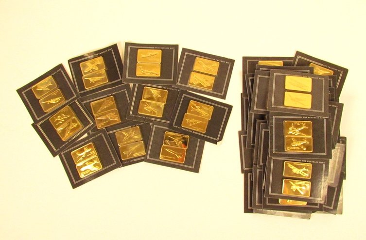 82 Franklin Mint Jane's Aircraft Ingots: Artist: Franklin Mint Title: 82 of The Jane's Medallic Register of the World's Great Aircraft ingots Medium: gold on bronze Dimensions: 1 x 2 inches (approx.) each