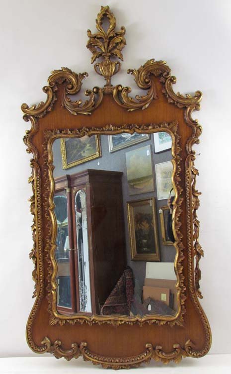 Elaborate Chippendale Style gilt wood mirror: Title: Elaborate Chippendale Style Gilt Wood Mirror ending in a Urn with climbing vines Date: 20th Century Dimensions: 62 x 31.5 inches Provenance: A regional Corporation