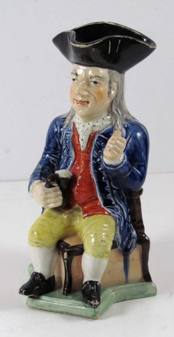 English Pottery Toby Jug: Title: Good Unusual Antique English Polychrome Pottery Toby Jug Date: circa 18th/Early 19th C. Medium: Glazed Pottery (earthenware) Dimensions: 11 1/4 x 6 1/2 x 6 inches Signature: Label on undersid