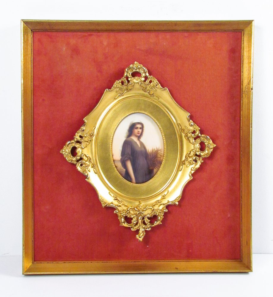 KPM Style painted ceramic plaque: Title: Young Peasant Woman with Sheathes of Wheat Dimensions: 5.25 x 4 inches Signature: with number 12 incised on reverse Frame Type: Victorian gilded plaster frame set Frame Size: 17.5 x 16 inches