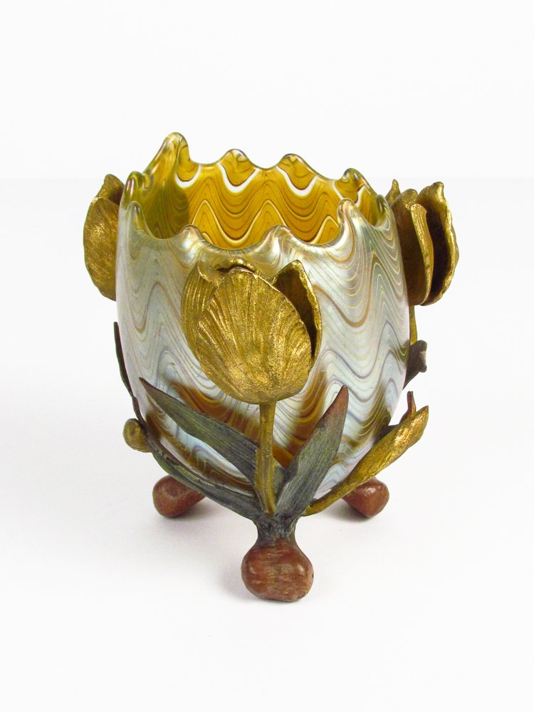 Loetz Glass Vase for E. Bakalowits Söhne c. 1900: Title: Iridescent Glass Vase inside of a gilt, green and brown patinated bronze mount Date: circa 1900 Dimensions: 5 inches tall and 5 inches diameter Signature: with "star" under all three feet