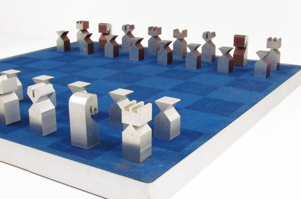 Austin Cox Modernist Aluminum Chess Set: Artist: Austin Cox for Austin Enterprises Title: Aluminum Chess Set (One Side Silver, One Side Copper Colored) Date: 1966 Medium: aluminum Dimensions: each pc approx. 2 inches Signature: C