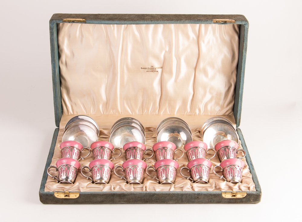 12 sterling frames & saucers Lenox Demitasse: Title: Boxed set of 12 sterling holders & saucers for pink Lenox Demitasse cups Date: early 20th Century Medium: sterling silver and porcelain Dimension: 17.4 ozt. 4 x 19 x 11.5 inches box Signature: