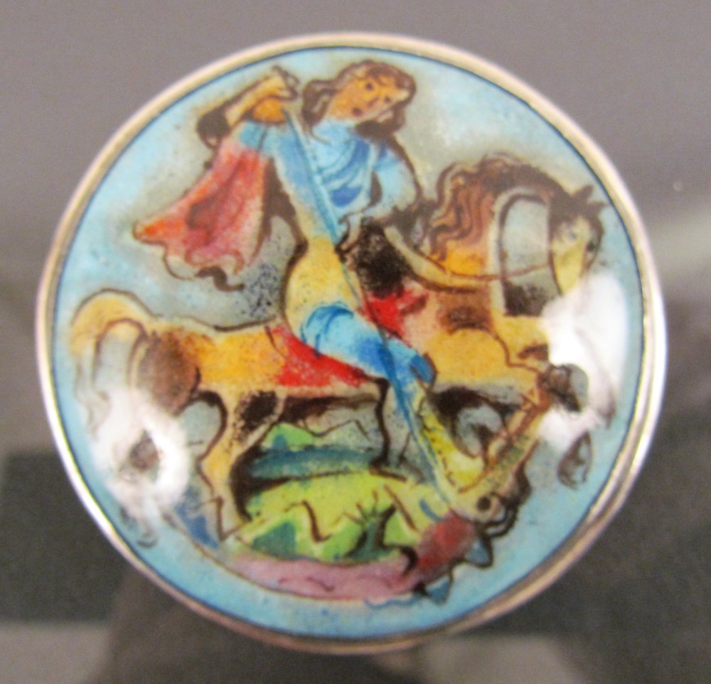 Painted Porcelain St. George and the Dragon Brooch: Artist: Jo Michels Title: Painted Porcelain St. George and the Dragon Brooch, framed in sterling silver, signed Jo Michels Medium: porcelain