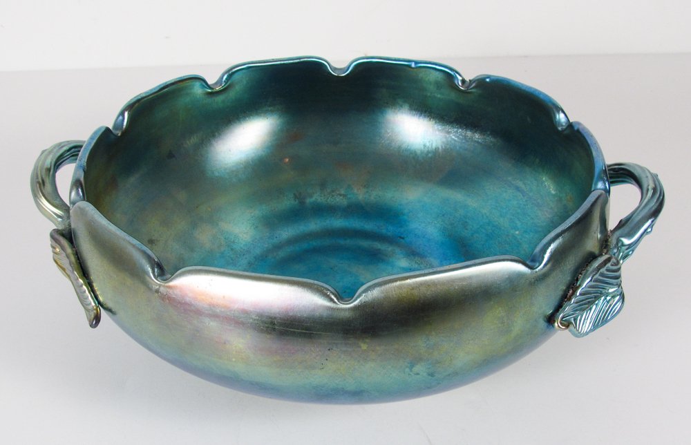 American Favrile glass bowl with leaf handles: Title: American Favrile glass bowl with leaf handles Medium: glass Dimension: 4,2 inches tall, 13,5 inches diameter Signature: bares the mark of Steuben