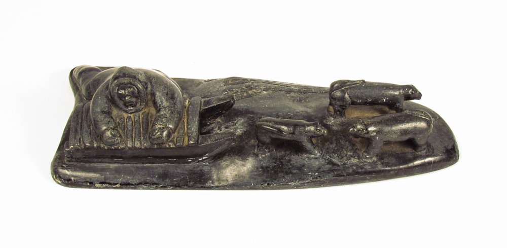 Inuit Soapstone Sculpture of Hunter, Sled, Dogs: Artist: 20th Century Canadian Eskimo Art Title: Inuit Hunter with Sled and Dogs Medium: carved soapstone Dimension: 3 x 11 x 5.5 inches Signature: signed on underside with Canadian Eskimo Art Tag on u