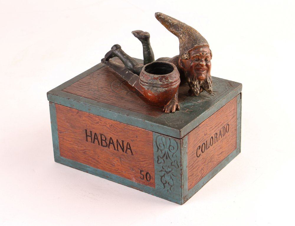 Metal Humidor with Gnome Lid: Title: Metal Humidor with Gnome Lid, marked Colorado Medium: painted metal Dimension: 6 x 4.5 x 6 inches