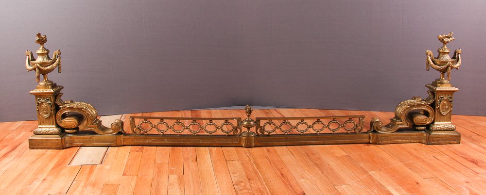 Neoclassical Fireplace Fender Bronze with outstanding: Title: Elaborate Neoclassical Bronze Fireplace Fender square fluted columns supported by acanthus scrolled brackets surmounted by swag draped urns. Beaded front oval chain arcade with smaller center f