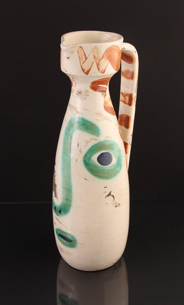 PABLO PICASSO; MADOURA 1969 Pitcher, "Face": Artist: PICASSO, Pablo (Spanish/French 1881 - 1973) Title: Face (Madoura Pitcher) Date: 1969 Medium: Glazed earthenware pitcher Dimension: 12 1/4 x 5 x 4 inches Edition: 195/500 Descripti