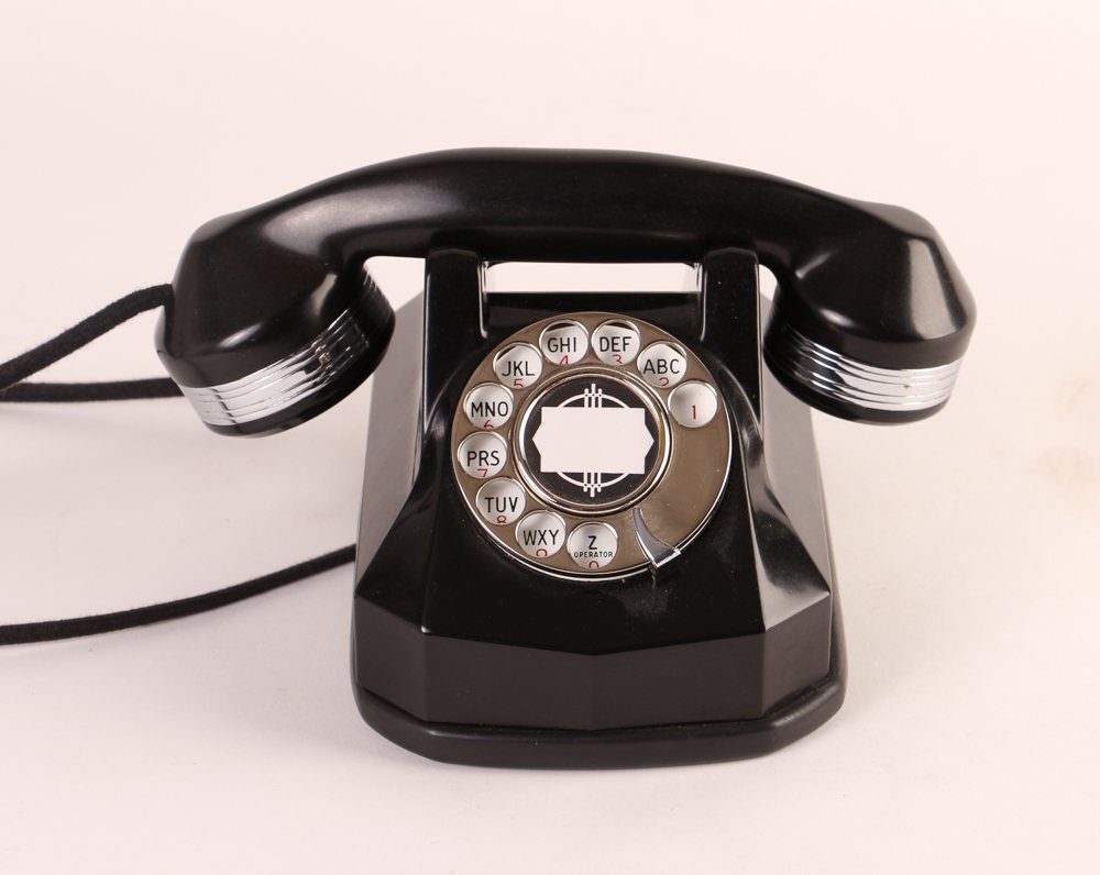 Monophone Bakelite Rotary Phone with Chrome Details: Bakelite Art deco geometrically shaped phone approx 6 inches tall with label on underside Monophone Automatic Electric Provenance: The Frank Giovannitti Collection from his Richard Meier Home on Woodl