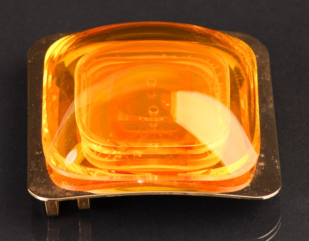 Aaronel Gruber Vacuum Formed Belt Buckle 1983: Artist: Gruber, Aaronel deRoy (American, 1918-2011) Title: Untitled Belt Buckle, 1983 (J033) Date: 1983 Medium: Vacuum formed Plexiglas mounted to brass as a belt buckle Dimensions: 3 x 3 x 1.2 inches