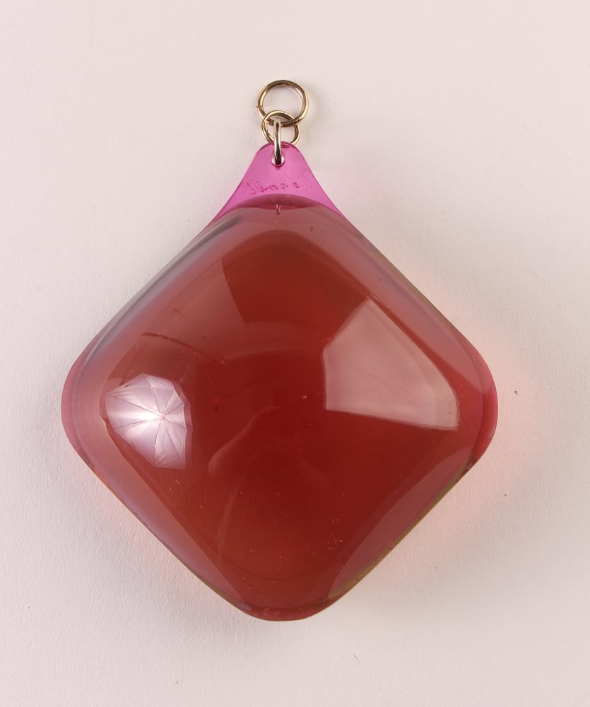 Aaronel Gruber Futurist Plum Colored Pendant: Artist: Gruber, Aaronel deRoy (American, 1918-2011) Title: Vacuum formed Layered Plum Colored transparent Plexiglas Pendant Medium: Vacuum Formed Plexiglas Pendant Dimensions: 2.5 x 2.5 inches Signatu