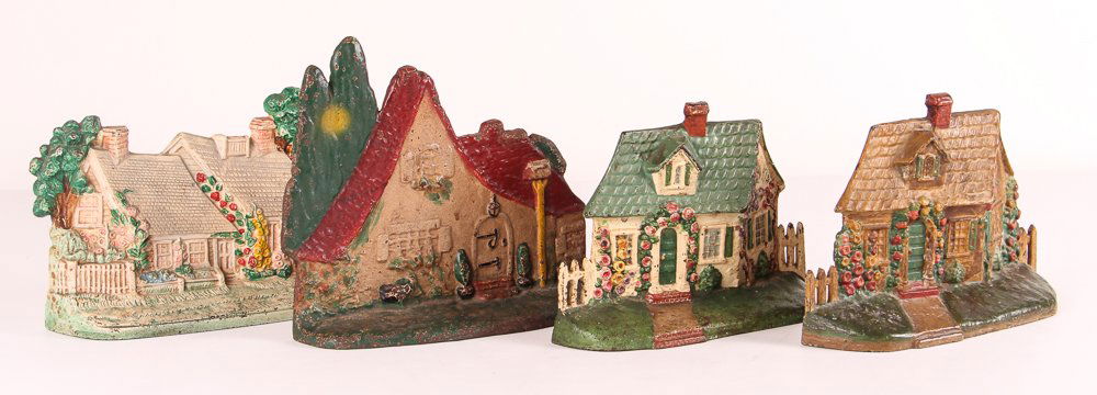Four Cast Iron Country Cottage Antique Doorstops: Title:Four Cast Iron Country Cottage Antique Doorstops Date:c. early 20th century Medium:painted cast iron Dimensions:largest: 7.25 x 8.5 x 3, smallest: 5.5 x 7.75 x 2 inches