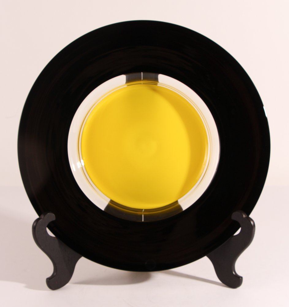 Timo Sarpaneva (1926-2006) for Venini 'Tuuli' plate: Timo Sarpaneva (1926-2006) for Venini 'Tuuli' plate, black rim and yellow center, etched signature venini 90 Sarpaneva on underside,16 inches in diameter and 1.75 inches tall; Provenance: The Venini F
