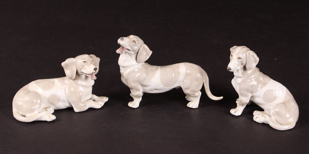 Three Capodimonte Dachshunds: Three porcelain Capodimonte dachshunds, each approximately 5 inches.