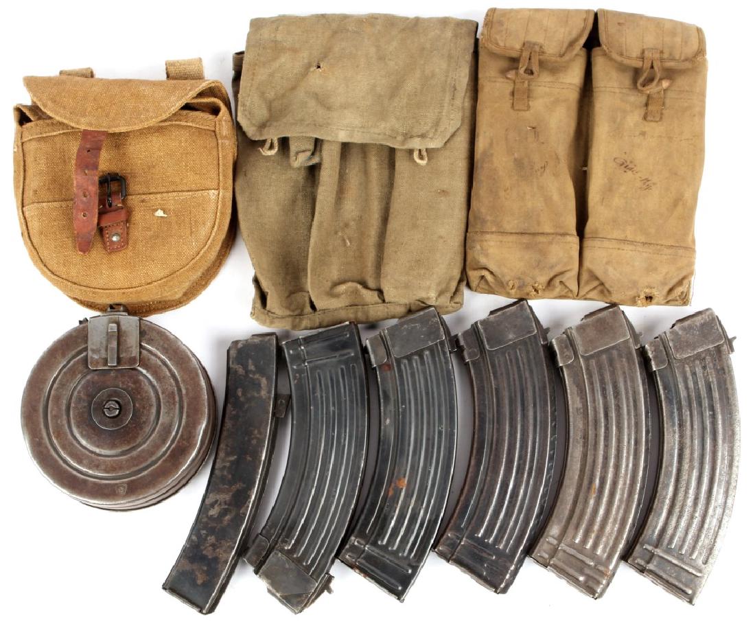 VIETNAM ERA AK47 PPSH-41 MAGAZINE AND POUCH LOT: VIETNAM ERA AK47 PPSH-41 MAGAZINE AND POUCH LOT 8 magazines, 3 pouches. Caliber / Gauge: 7.62x39