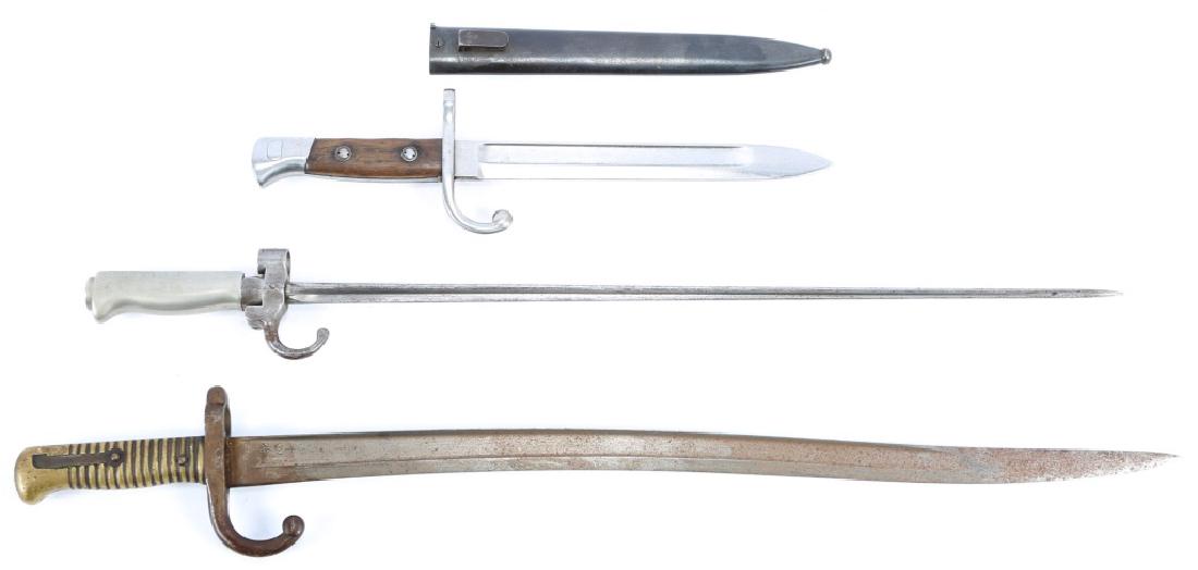 WORLD BAYONET LOT OF 3: WORLD BAYONET LOT OF 3 French M1866 Chassepot bayonet (Blade length: 22.5", Total length: 27.25"). Belgian M1889 Mauser short bayonet with scabbard (Blade length: 9.5", Total length: 14.5"). French 18