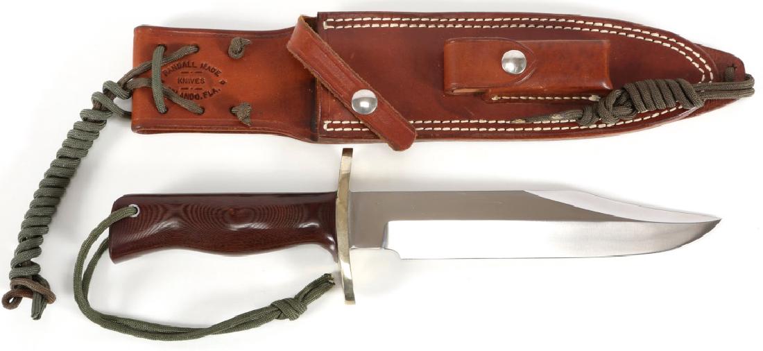 RANDALL MODEL 14 ATTACK KNIFE WITH SHEATH: RANDALL MODEL 14 ATTACK KNIFE WITH SHEATH Original leather sheath marked "RANDALL MADE KNIVES - ORLANDO, FL". Handle is brown. Blade Length: 7.5" Overall Length: 12.25"
