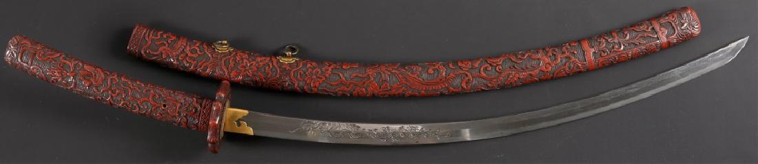 JAPANESE KATANA WITH SNAKE HORIMONO-SUKEYOSHI 1862: JAPANESE KATANA WITH SNAKE HORIMONO-SUKEYOSHI 1862 Nakago signed on obverse "Made by the smith Sukeyoshi of the Yokoyama school. While living in Bizen province. 58th generation grandson of Tomonari."