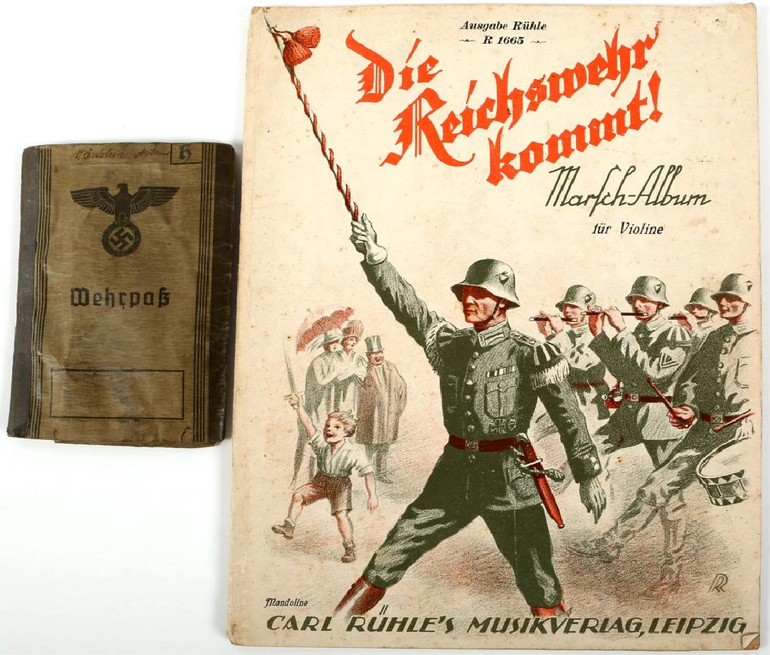 WWII GERMAN BOOK LOT OF 2 WEHRPASS, MARCH ALBUM: WWII GERMAN BOOK LOT OF 2 WEHRPASS, MARCH ALBUM Wehrpass stamped "Coburg, den 19. Mai 1939". March Album printed "Die Reichswehr kommt! tur Violine" and " Carl Ruhle's Musikverlag, Leipzig".