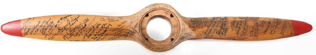 WWII REUNION SIGNED PROPELLER: WWII REUNION SIGNED PROPELLER Wood propeller with painted tips. Over 50 signatures including USN, AAF, transcontinental air race, and WASP pilots. Size: 25"