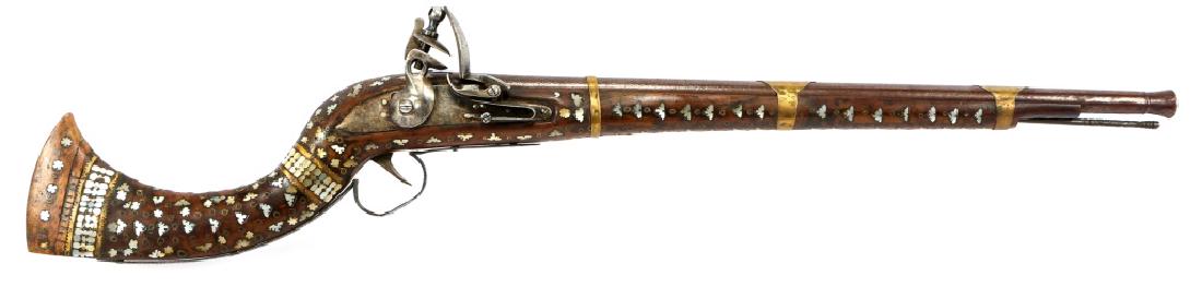 INDIAN JEZAIL 62 CAL FLINTLOCK MUSKET W/ MOP INLAY: INDIAN JEZAIL 62 CAL FLINTLOCK MUSKET W/ MOP INLAY Tower style lockplate. Rearing lion with crown over 3 proof mark. Mother of pearl and brass ring inlay throughout wood stock. Checkered pattern down 