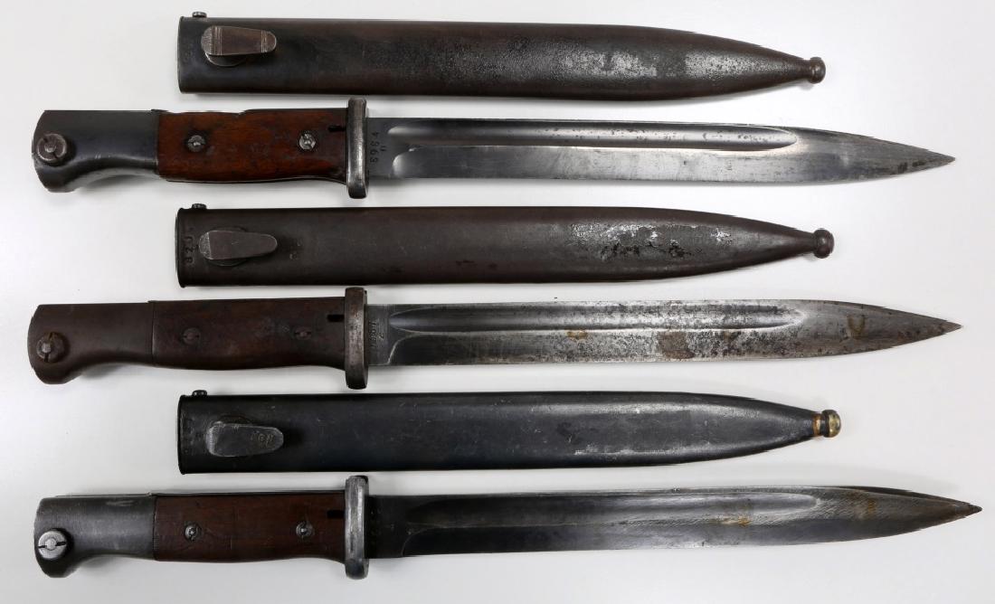 WWII GERMAN MAUSER K98 COMBAT BAYONET LOT OF 3: WWII GERMAN MAUSER K98 COMBAT BAYONET LOT OF 3 Wood handles. Blade stamped "F. Herder A.Sn", scabbard "44 cul", mismatch numbers. Blade stamped "43 ASW", scabbard "44 ASW", mismatch numbers. Blade sta