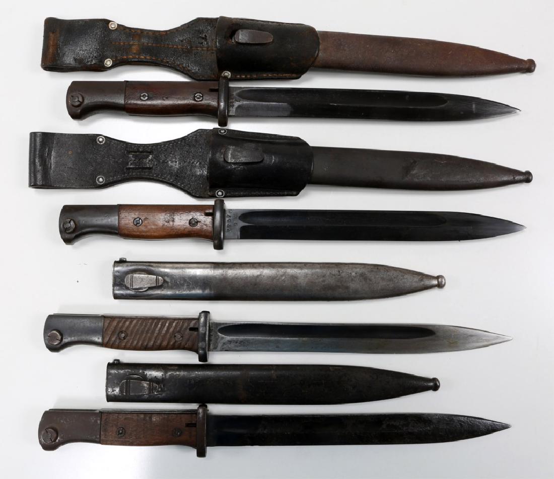 WWII GERMAN MAUSER K98 COMBAT BAYONET LOT OF 4: WWII GERMAN MAUSER K98 COMBAT BAYONET LOT OF 4 Wood handles. Carl Eickhorn matching numbers 2257, blade & scabbard stamped "41 COF", leather frog. Blade stamped "43 AGV", scabbard "FZE 37" mismatch nu