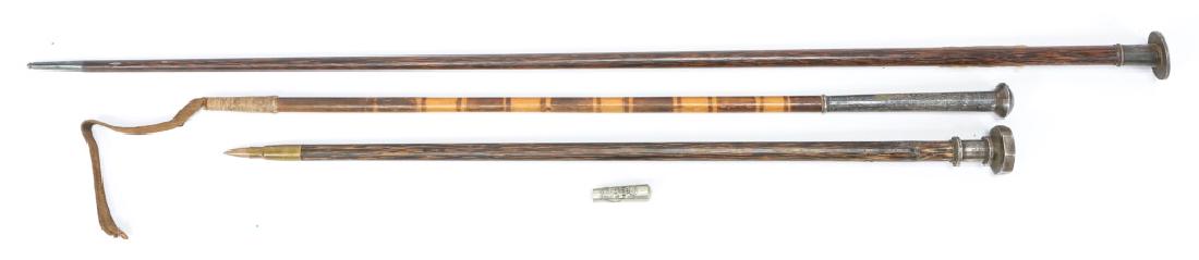 SWAGGER STICK AND RIDING CROP LOT OF 3: SWAGGER STICK AND RIDING CROP LOT OF 3 2 1900 Swagger Sticks. 24" Stick engraved "Frederic Hill U.S.V. Sargt. Co "L" 43 Inf. Jan 27, 1900". 36" Stick has a Great Britain Silver Dollar soldered on cap.