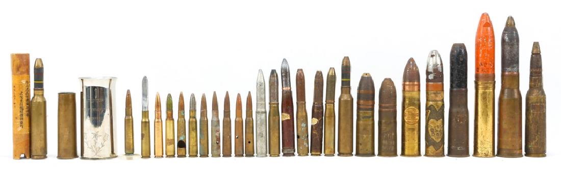 WWI SHELL TRENCH ART LOT OF 29: WWI SHELL TRENCH ART LOT OF 29 WWI shell trench art. Some pieces marked "FRANKFURT A/M GERMANY 1946", "ARGONNE", and "WORLD WAR". One Japanese shell has matching box. Lot weighs 20LB. Size: 5-12"