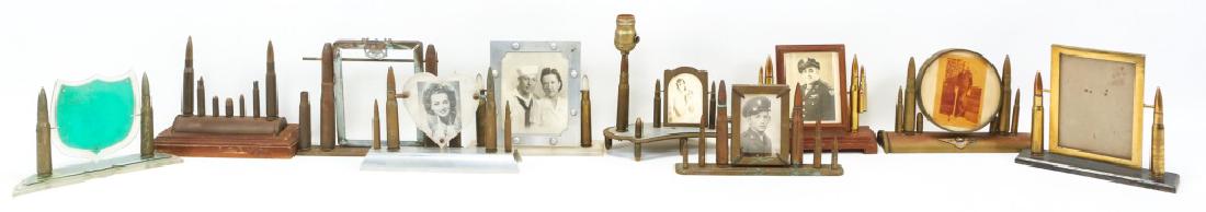 WWII SWEETHEART PICTURE FRAME LOT OF 10: WWII SWEETHEART PICTURE FRAME LOT OF 10 One frame with lamp installed. One frame with vanity mirror on reverse side. One ammunition display piece. Some frames marked "US Navy". Total weight 19LB. Size