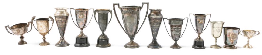 US MILITARY GAMES TROPHY LOT OF 12: US MILITARY GAMES TROPHY LOT OF 12 12 mid-size military trophies. Some engravings read: "Second Place Desbatfor Raceboat Finals Fall-1937 U.S.S Wasmuth T. Whychell," "182nd Inf. Outdoor Rifle League 1