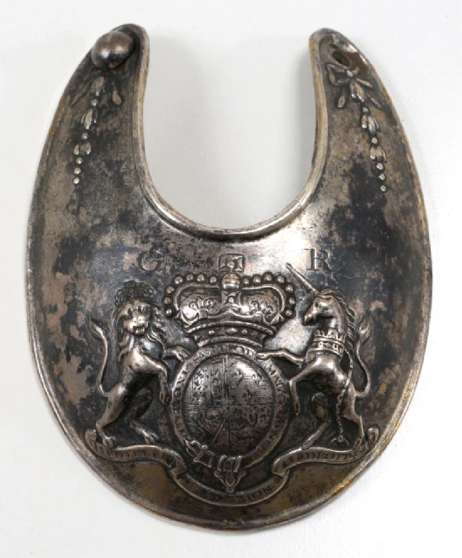 KING GEORGE III BRITISH OFFICER WHITE METAL GORGET: KING GEORGE III BRITISH OFFICER WHITE METAL GORGET White Metal British officer’s gorget bearing Royal Coat of Arms of King George III; stamped “GR”; with side decorations. Size: 3.1/2" X 4.1/4"