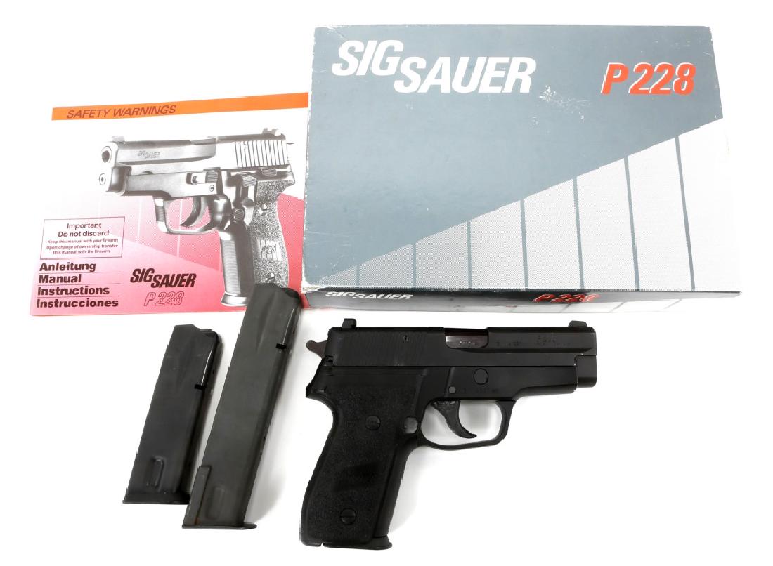 SIG SAUER MODEL P228 9mm PISTOL: SIG SAUER MODEL P228 9mm PISTOL Sig Sauer model P228 9mm Pistol with one extended magazine, and one normal magazine, in original box. Model: P228 Caliber / Gauge: 9mm Barrel Length: 3.75" Serial Numbe