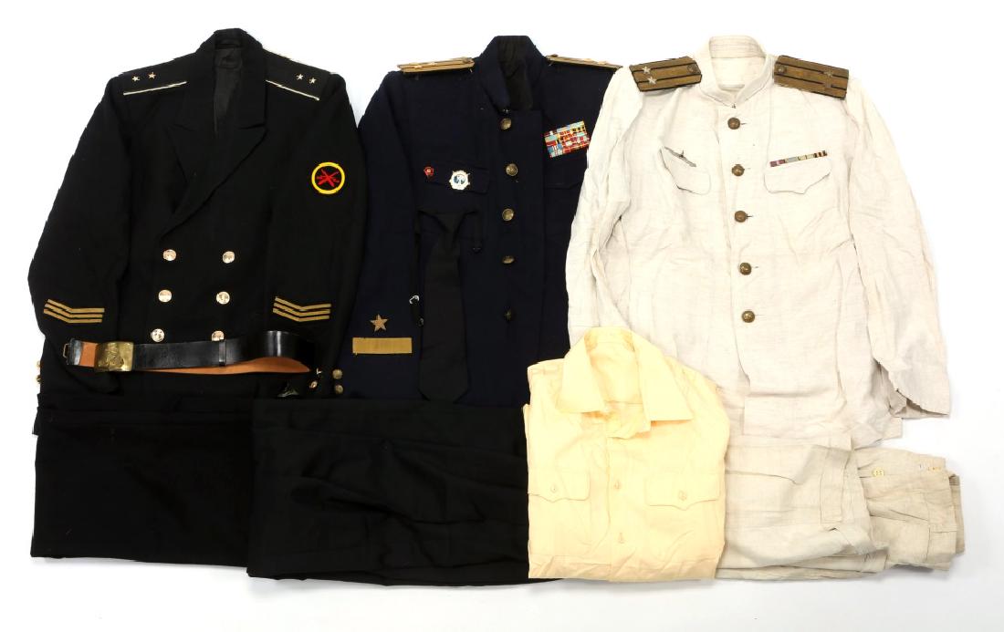 SOVIET NAVY DRESS UNIFORM MIXED LOT: SOVIET NAVY DRESS UNIFORM MIXED LOT Pre 1954 Summer white officer uniform, tunic with ribbons and pants. Late 1950's Officer Blue service dress, tunic with ribbons and badge, black pants. Late 1980's 