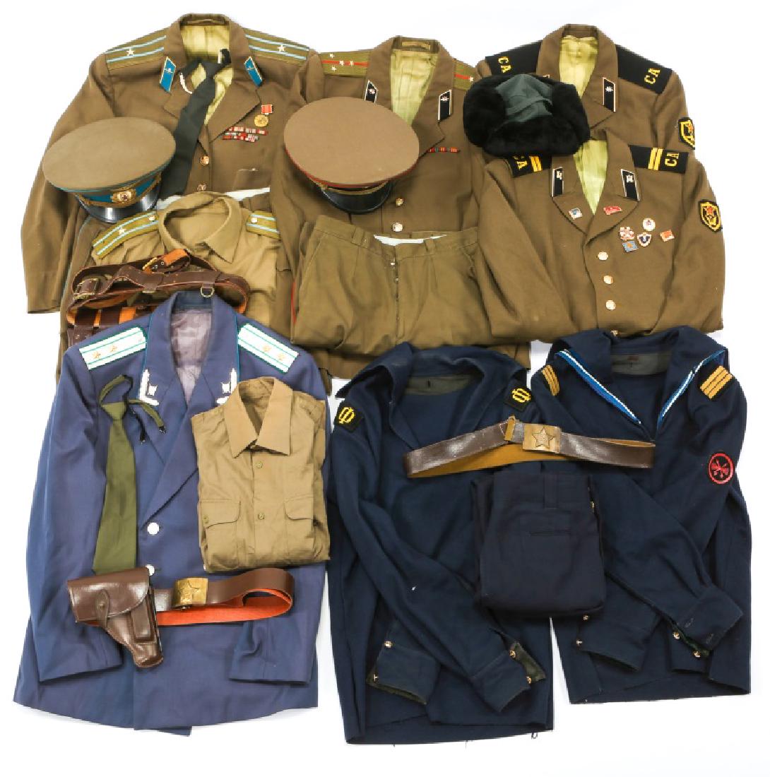 COLD WAR RUSSIAN ARMY DRESS UNIFORM LOT: COLD WAR RUSSIAN ARMY DRESS UNIFORM LOT Cold War, Russian Signal Corps, officer uniform, tunic, pants & hat. Two NCO's tunics. Paratrooper officer uniform, tunic & pants, hat, shirt, tie, leather belt